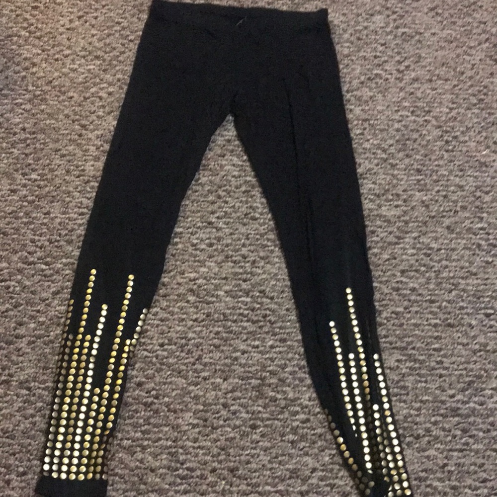 Tart Leggings with gold studs.